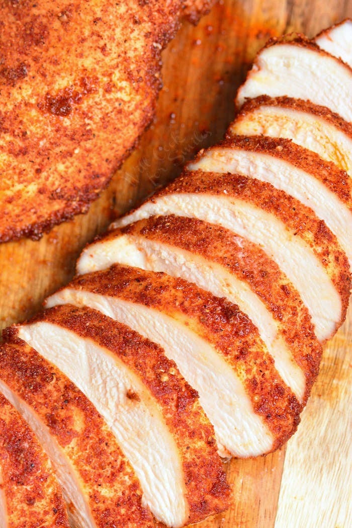 Baked Chicken sliced on cutting board 