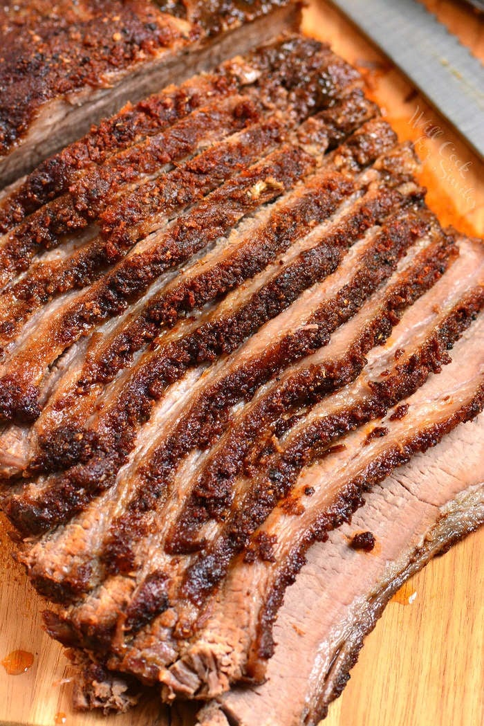 Beef Brisket cut up on wood cutting board 