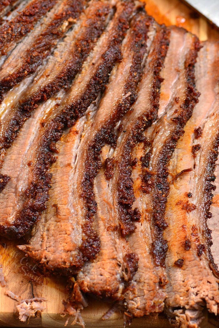 Beef Brisket cut up on wood cutting board 