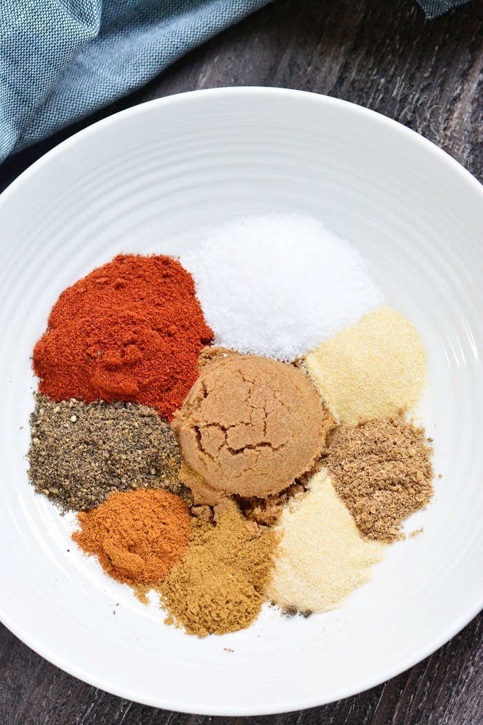 Dry Rub recipe in a white bowl on a wood table 