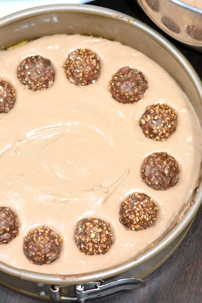 Making cheesecake with Ferrero Rocher Chocolate Hazelnut Truffles along the outside.