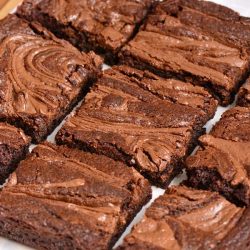 sliced up nutella brownies on parchment paper.