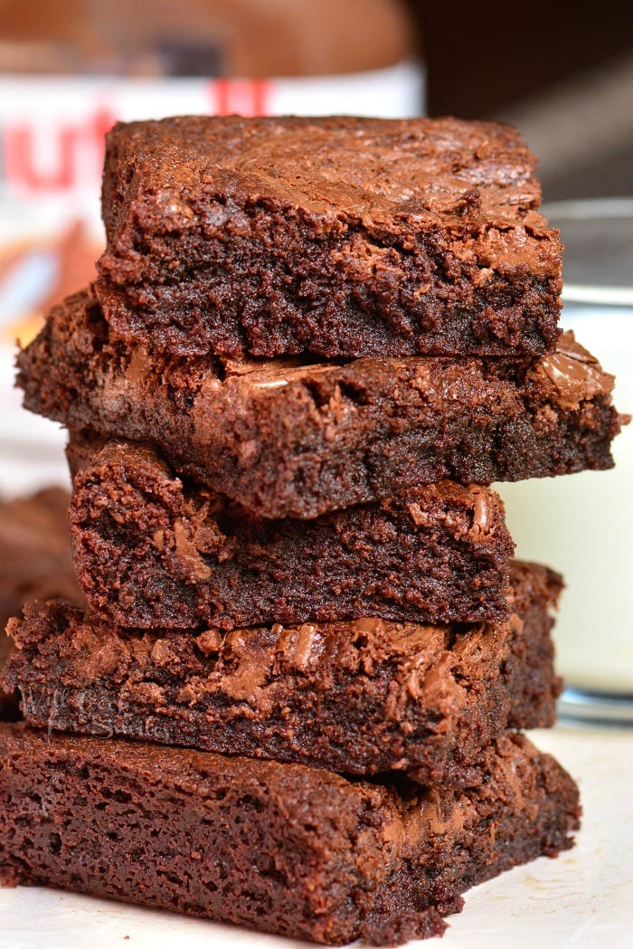 Nutella Brownies stacked up on a piece of a wax paper 