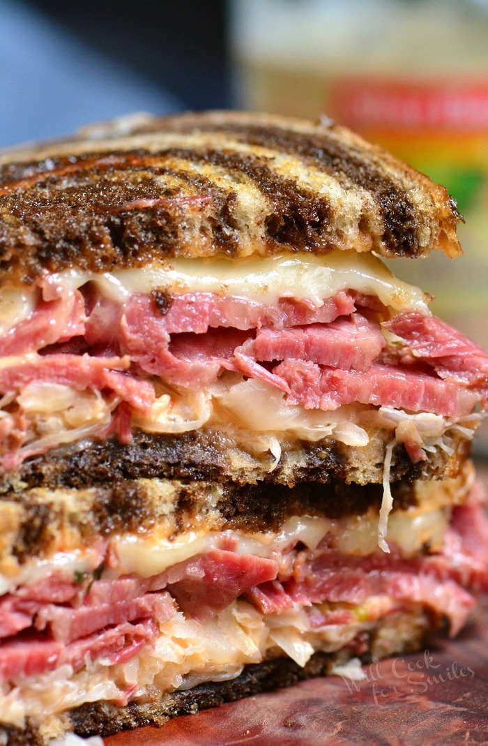 Reuben Sandwich cut and stacked on cutting board 