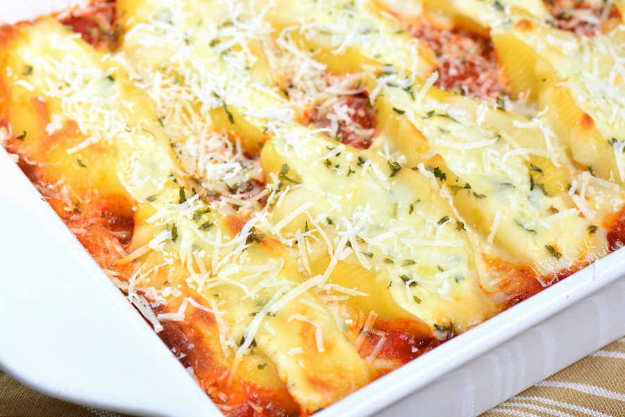 Stuffed Shells made with flavorful three cheese ricotta filling and homemade marinara sauce. This stuffed shells recipe is extra cheesy and made with fresh herbs and garlic flavors. #pasta #stuffedshells #meatless #ricotta
