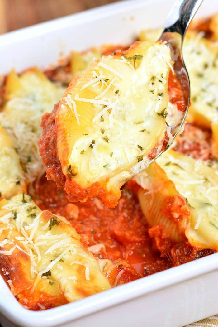 Stuffed Shells made with flavorful three cheese ricotta filling and homemade marinara sauce. This stuffed shells recipe is extra cheesy and made with fresh herbs and garlic flavors. #pasta #stuffedshells #meatless #ricotta