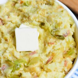 top view of colcannon in a bowl with square of butter.