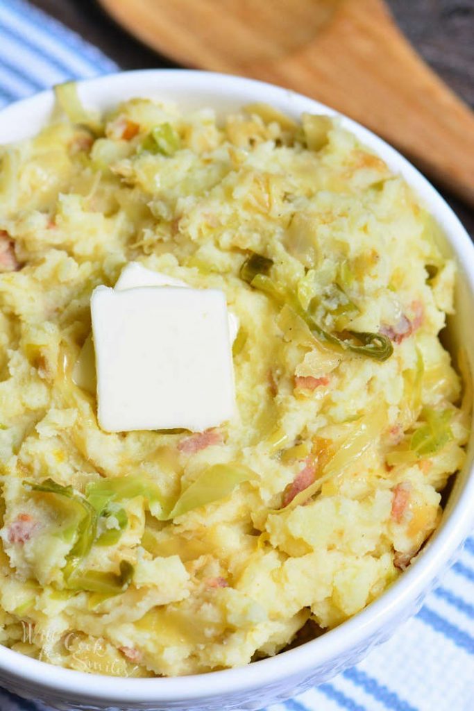 top view of colcannon in a bowl with square of butter.