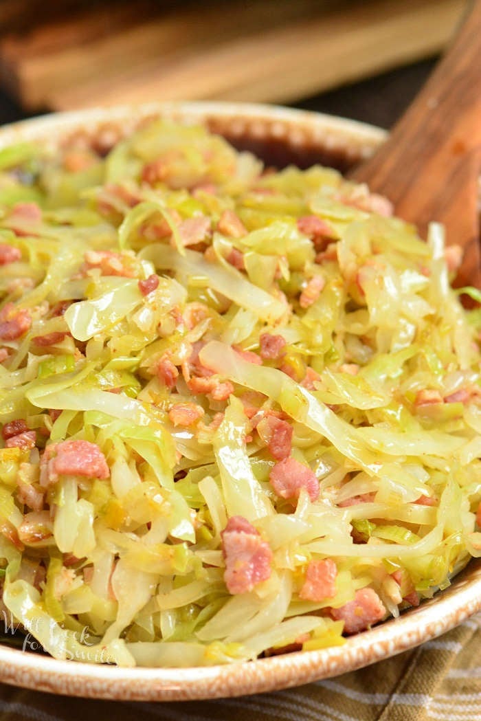 Fried cabbage is a tasty combination of cabbage, leeks, and bacon and simply seasoned with salt and pepper. This simple side dish is done in about 30 minutes. #sidedish #cabbage #bacon #easydinner