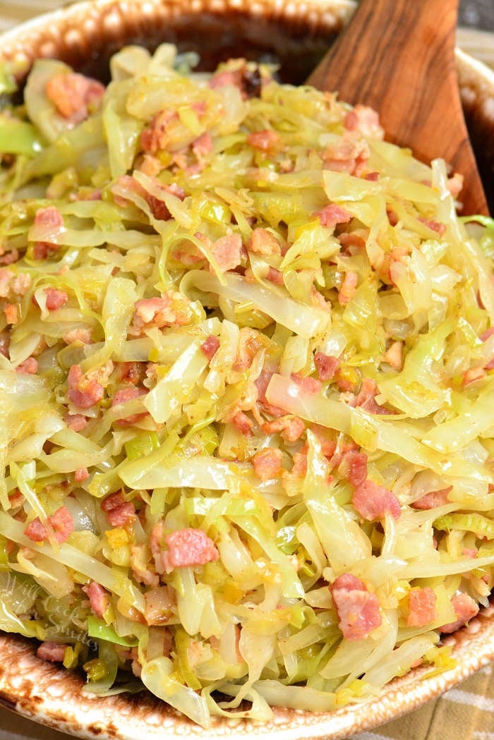Fried Cabbage is a tasty combination of cabbage, leeks, and bacon and simply seasoned with salt and pepper. This simple side dish is done in about 30 minutes. #sidedish #cabbage #bacon #easydinner