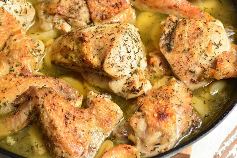 Garlic Chicken. Amazing baked chicken made with lots of garlic, white wine, chicken broth, and herbs. Learn how to easily break down the whole chicken for this garlic chicken recipe. #chicken #bakedchicken #garlicchicken #easydinner