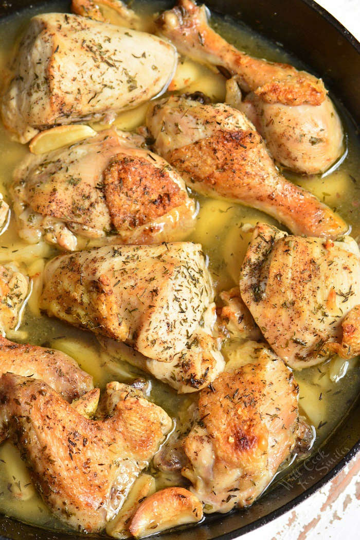 Garlic Chicken. Amazing baked chicken made with lots of garlic, white wine, chicken broth, and herbs. Learn how to easily break down the whole chicken for this garlic chicken recipe. #chicken #bakedchicken #garlicchicken #easydinner