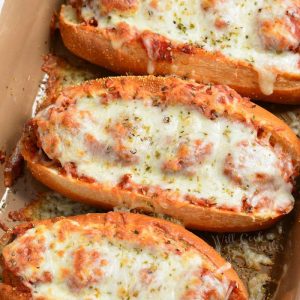 top view of three meatball subs in baking dish