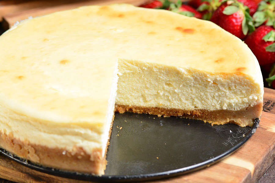 whole cheesecake with a couple slices taken out