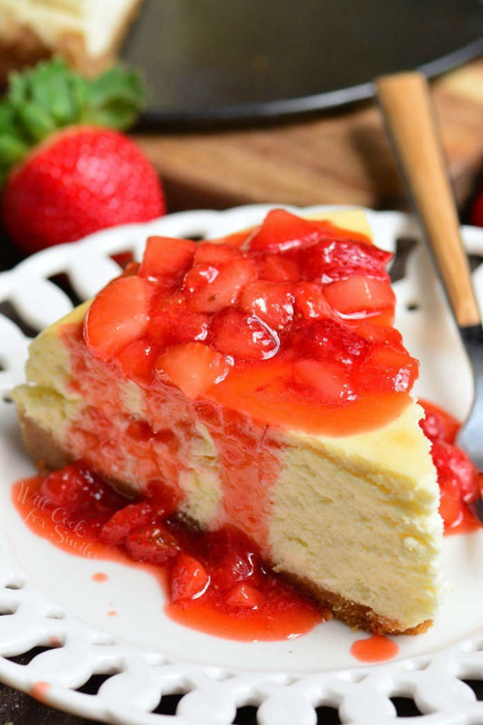closeup of NY cheesecake topped with strawberry topping