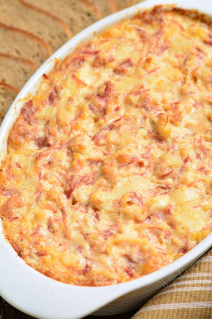 top view of baked reuben dip in a white baking dish.