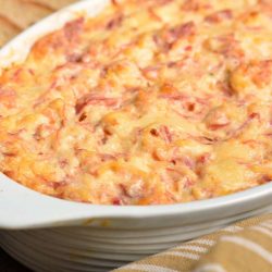 baked Reuben dip with crackers around.