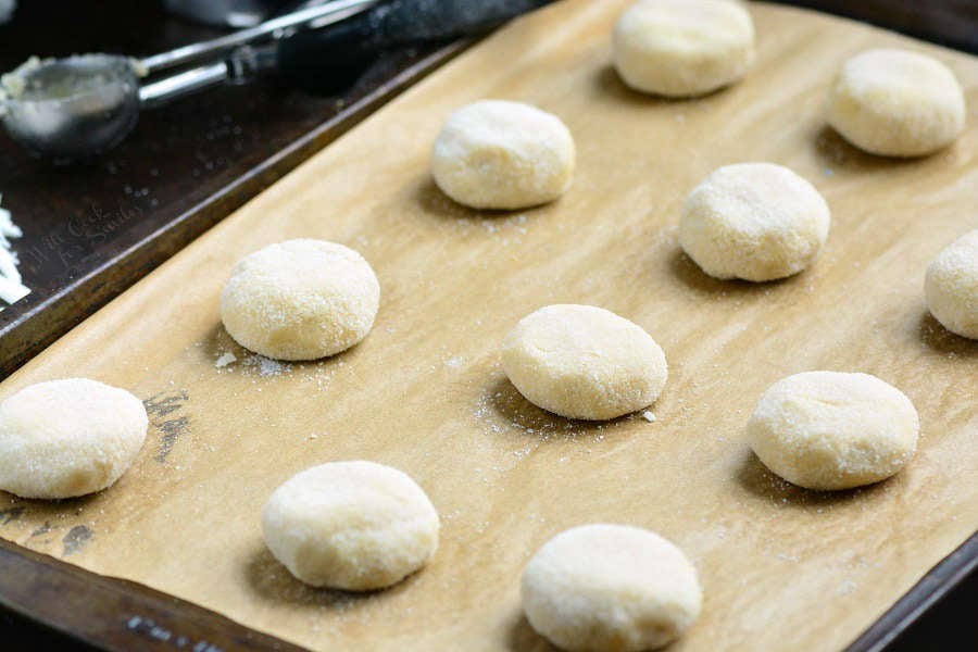 Soft Sugar Cookies on wax paper on a baking sheet 