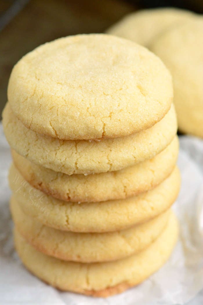 Soft Sugar Cookies stacked up on wax paper 