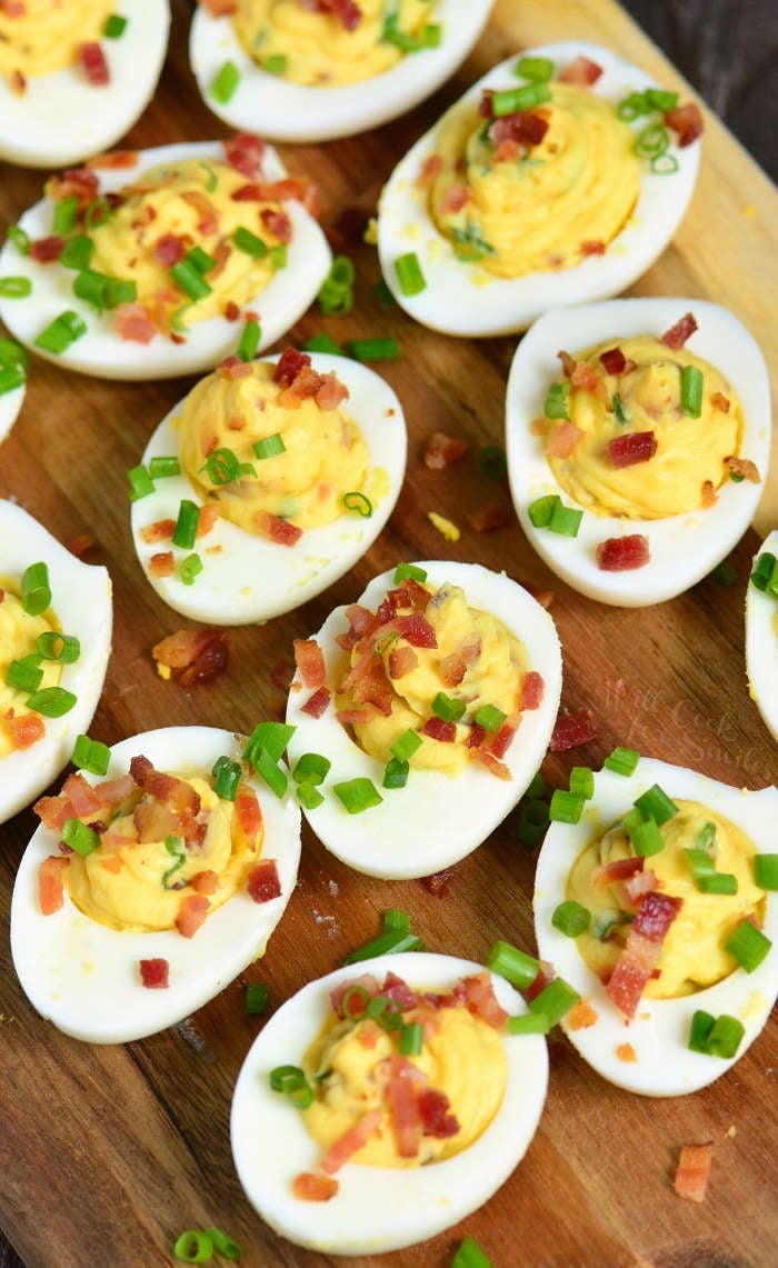 Bacon Deviled Eggs is a classic recipe taken to a whole new level. Hard boiled eggs are filled with a mixture of egg yolks, mayo, and mustard, bacon and chives. 