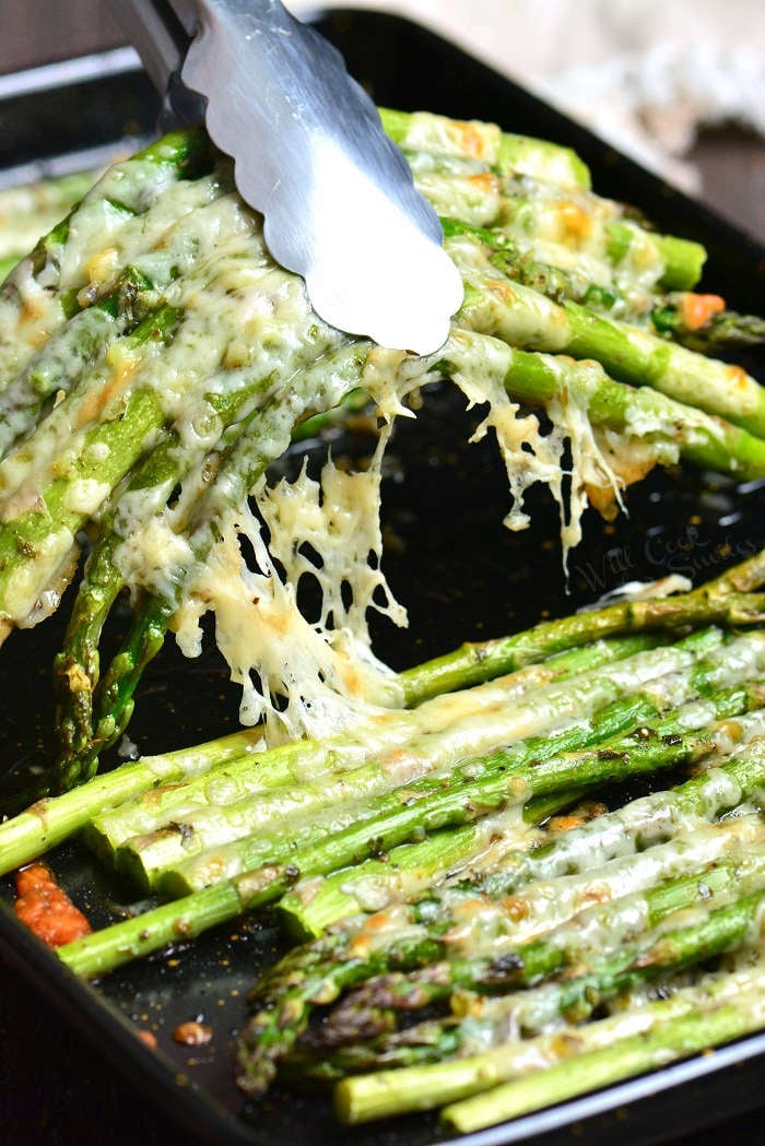 Easy Roasted Asparagus is a simple side dish that will be ready in less than 20 minutes. It's made with addition of Italian flavors like oregano, parsley, and Parmesan cheese.