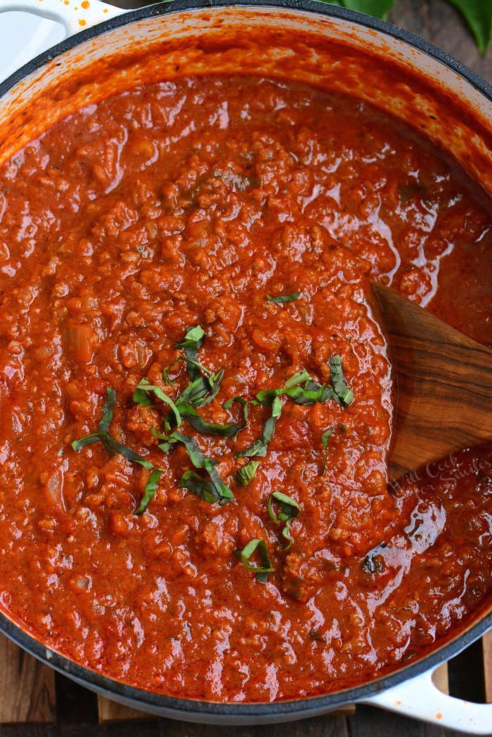 Homemade Bolognese Sauce on a stock pot with a wooden spoon 