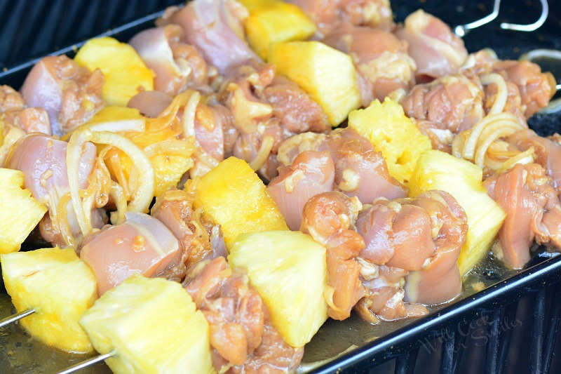 raw chicken with pineapple kebabs on the grill 