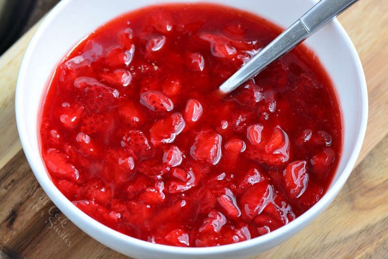 Homemade strawberry filling in a white bowl 