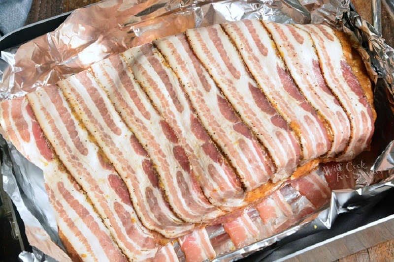 brisket in a roasting pan lined with foil