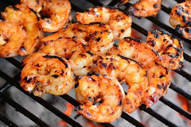 Cajun shrimp on the grill on skewers done cooking