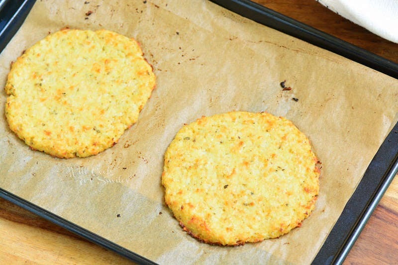 cooked cauliflower on parchment paper on a baking sheet 