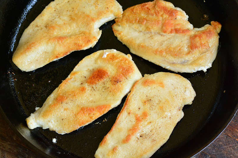 seared chicken in a cast iron skillet 