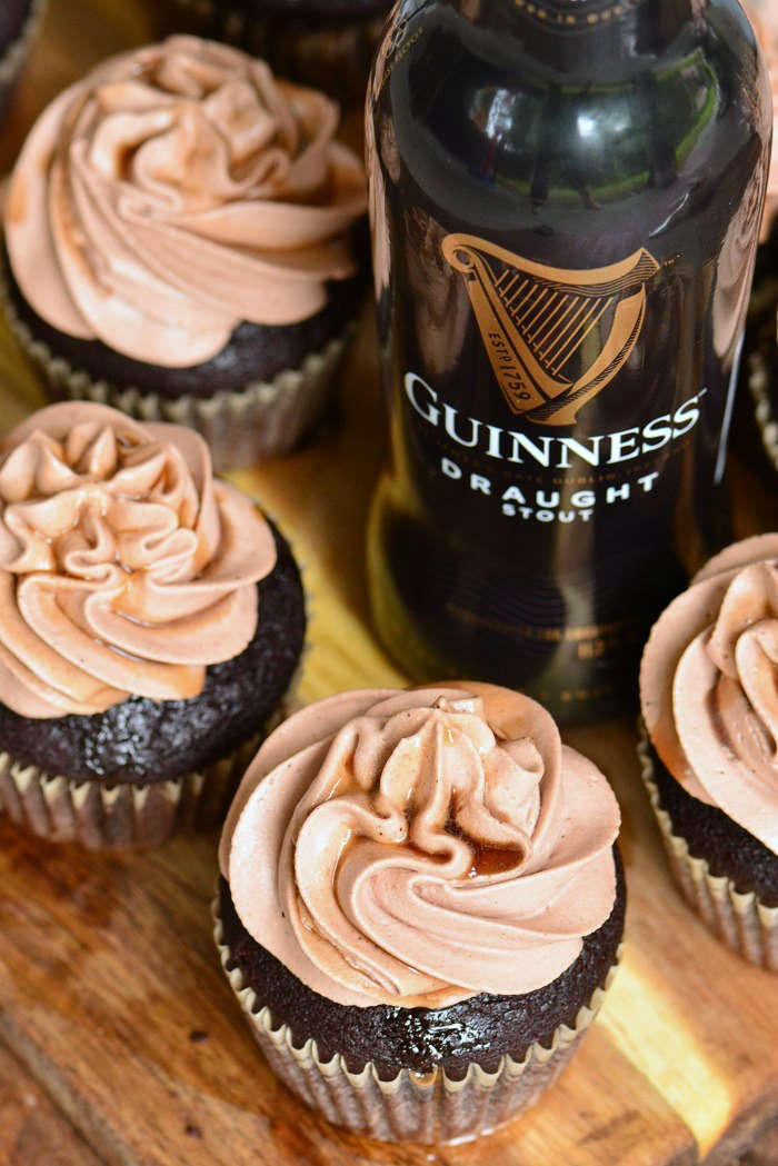 chocolate stout cupcakes with Guinness beer on wood cutting board 