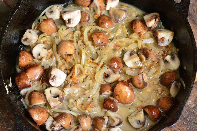 mushroom and onion topping in a cast iron skillet 