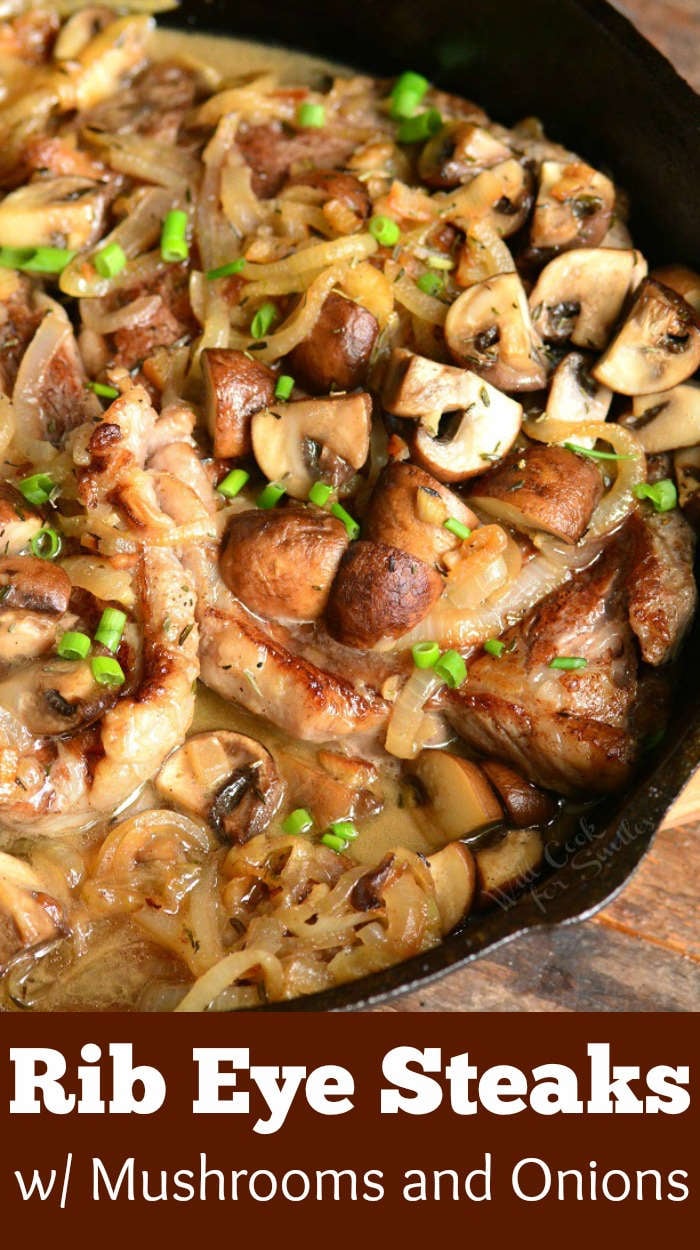 Rib Eye Steaks in mushrooms and onions in a cast iron skillet 