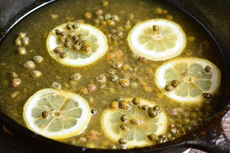 sauce for salmon piccata in a cast iron pan 