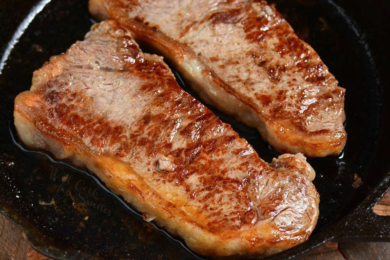 cooked steaks in the cast iron skillet