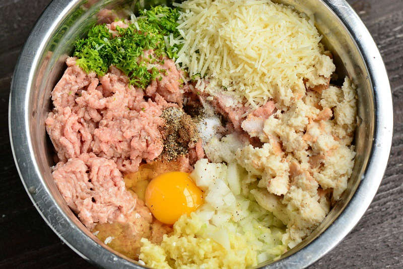 ingredients in a turkey burger in a metal bowl 