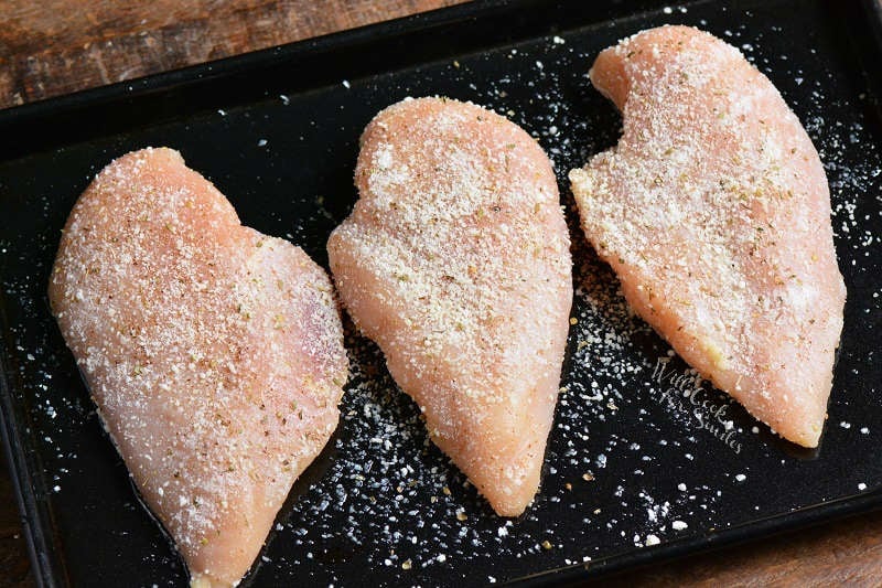 Raw Chicken breast on a baking sheet 