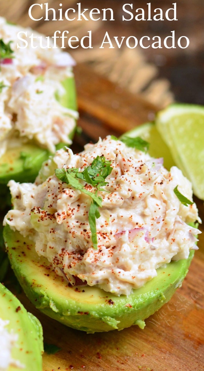 closeup of a chicken salad stuffed avocado and title.