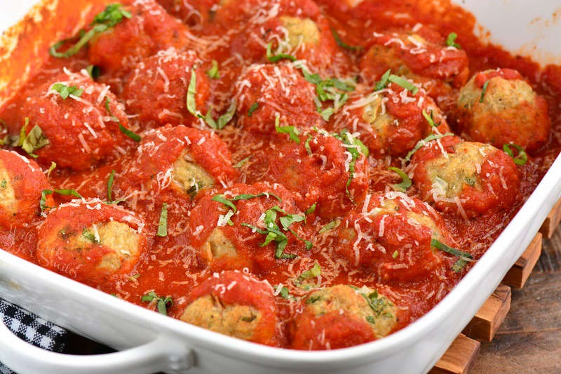 chicken meatballs with marinara in a baking dish 