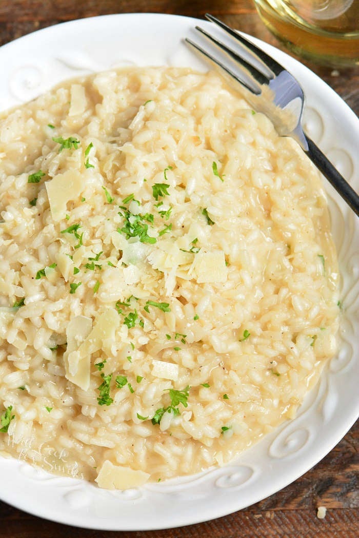 Parmesan risotto in a bowl with a fork 