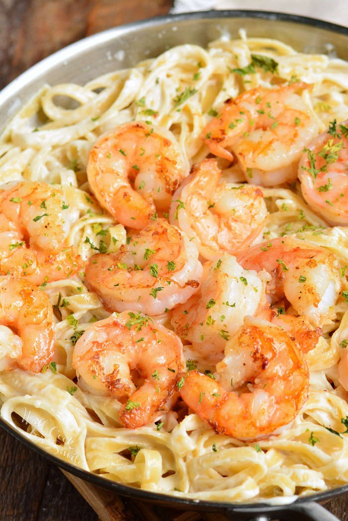 shrimp alfredo fettuccine in a pot 