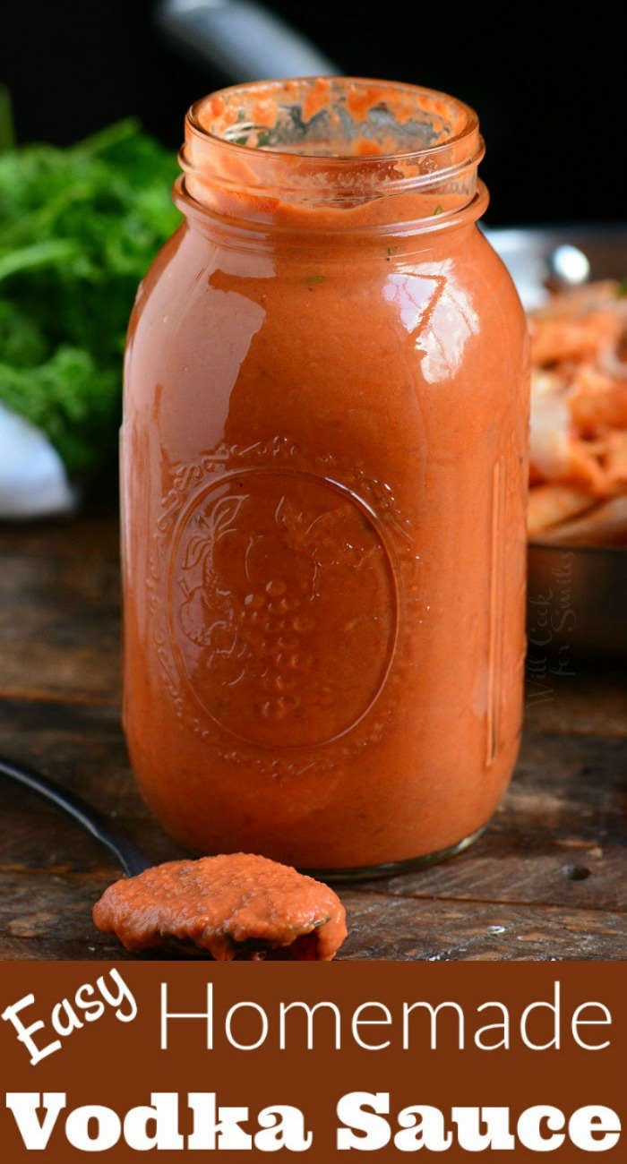 vodka sauce in a glass jar with a spoon full of vodka sauce on a wood board 