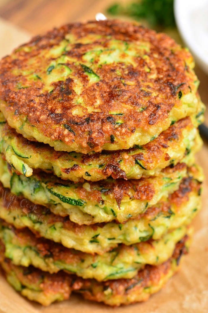 zucchini fritters stacked up on top of each other 