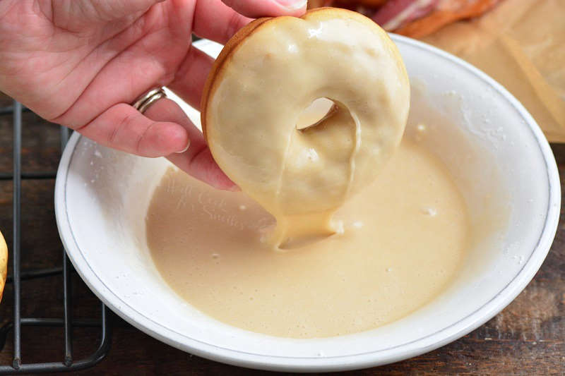 glazing a donut in a bowl 