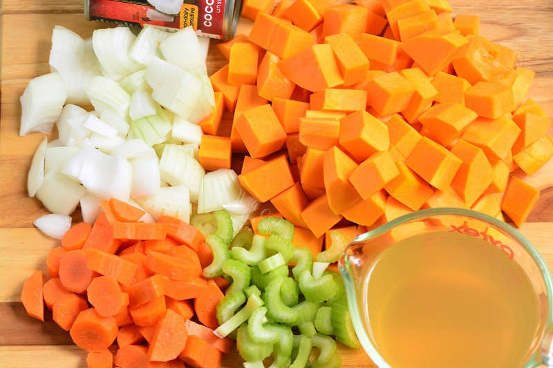 ingredients in butternut squash soup on a cutting board 