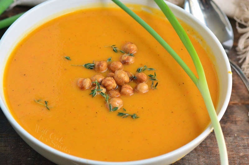 butternut squash soup in a bowl with chickpeas on top 