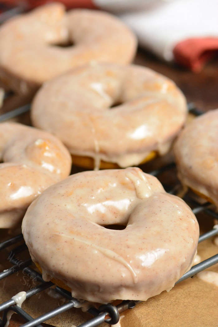 pumpkin donuts on a cooling rack 