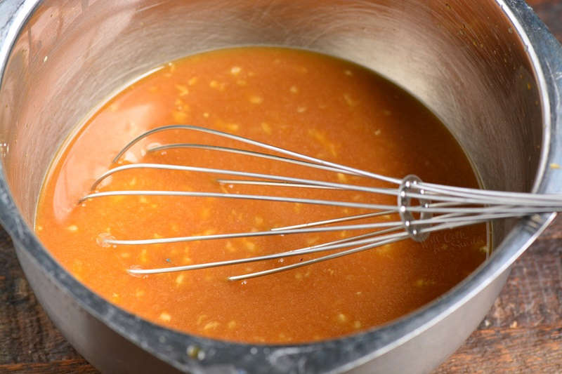 teriyaki sauce ingredients in a bowl with a metal whisk 